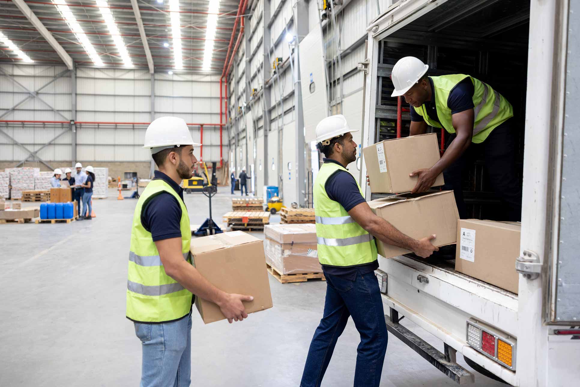 Warehouse crew unloading a container